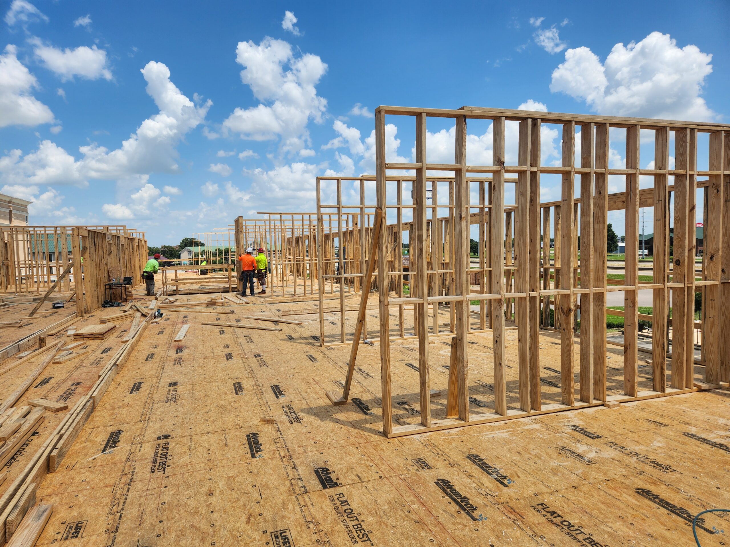 My Place Hotel with construction workers working on framing in Jonesboro, AR