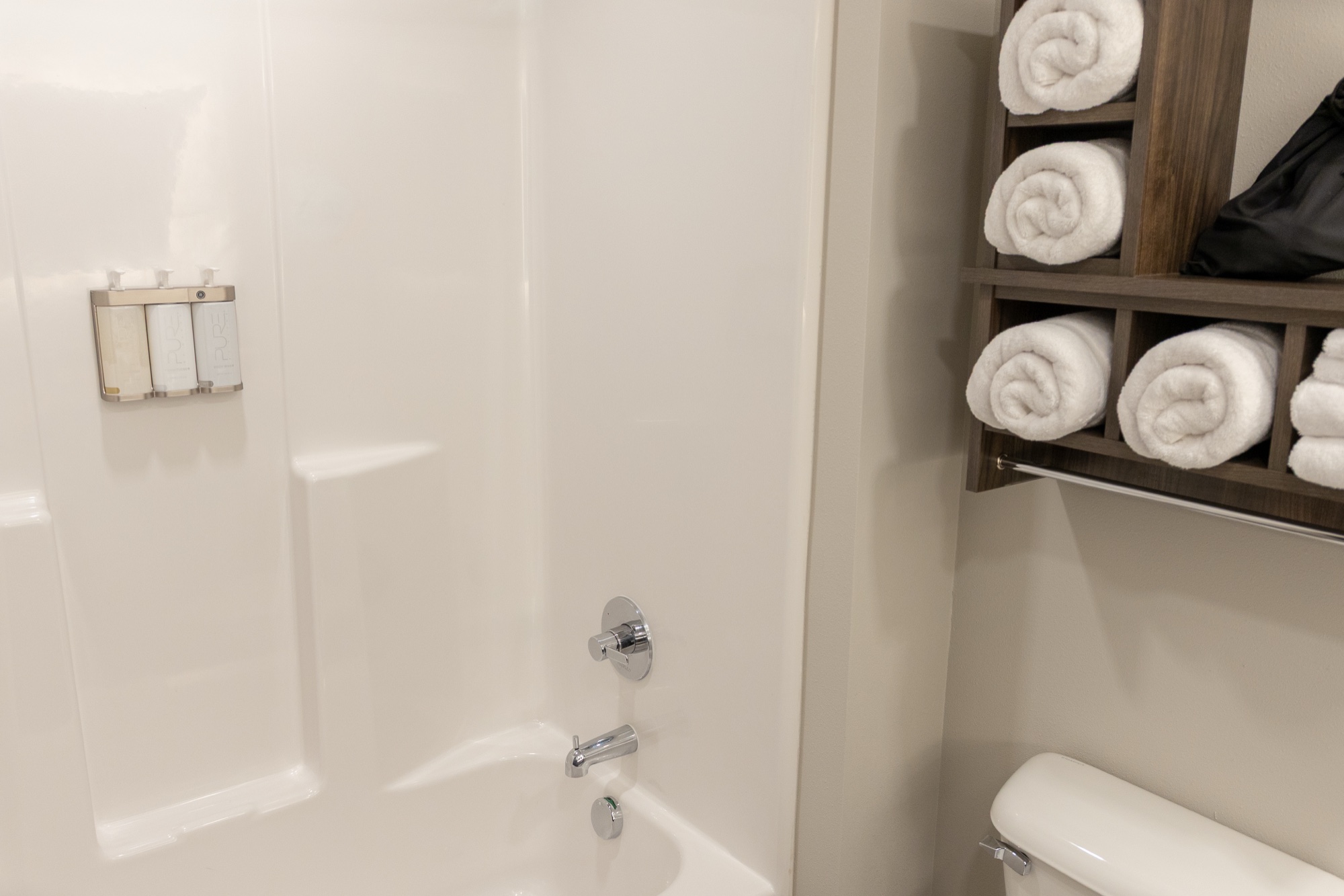 Guest bathroom with tub and shower at My Place Hotel Jonesboro