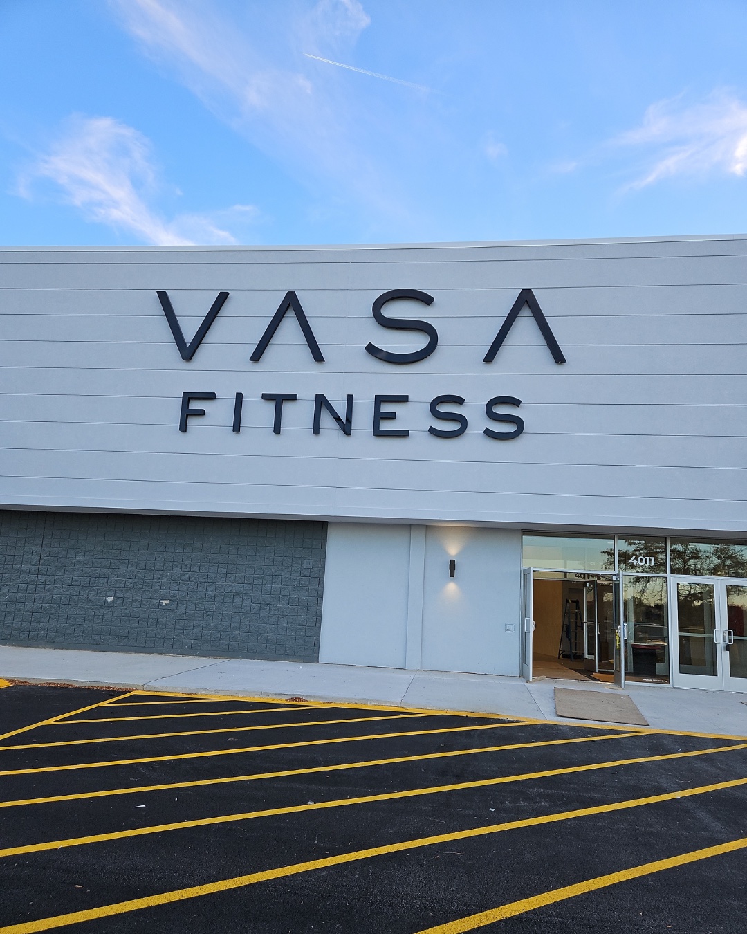 Exterior of VASA Fitness Matteson, a converted big box retail building with new signage and a freshly striped parking lot